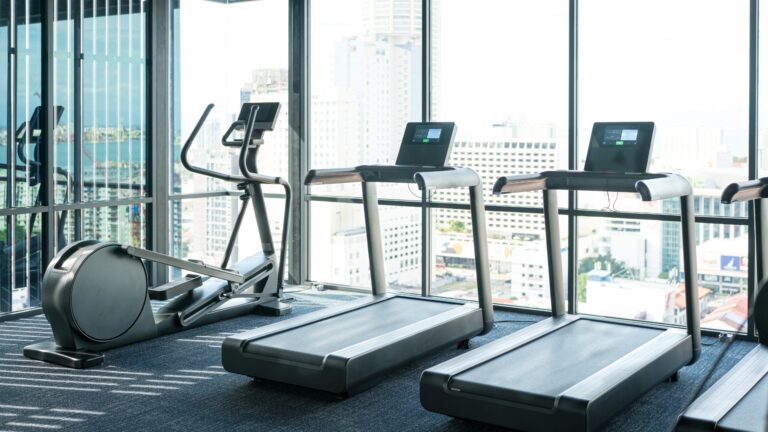 Fully equipped gymnasium at Prestige Tellapur for fitness and strength training.