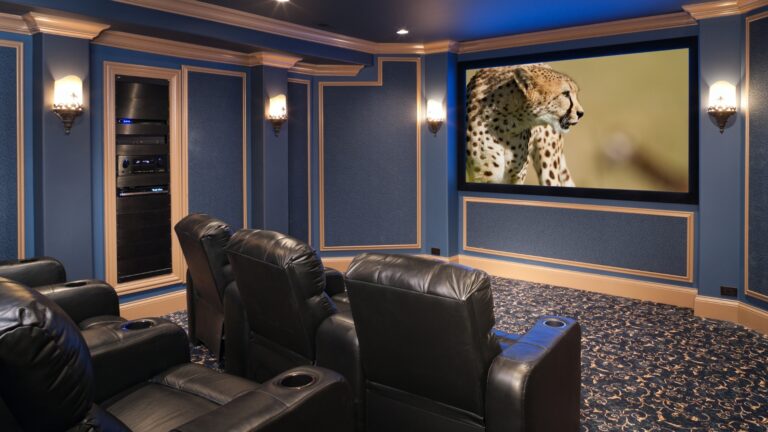 Indoor mini theater at Prestige Tellapur with comfortable seating and screen.